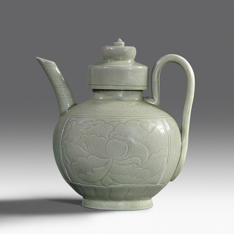 A Yueyao carved and incised ewer and cover A Yueyao carved and incised ewer and cover