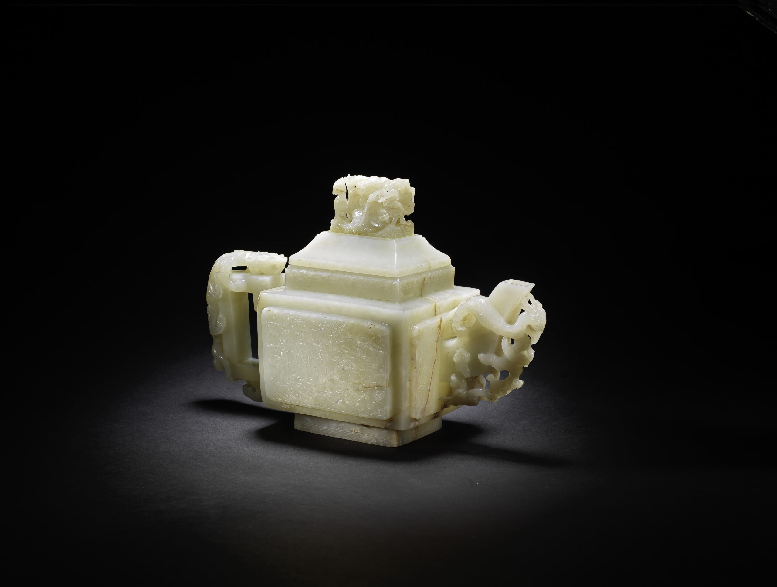 A LARGE PALE CELADON JADE 'EIGHT IMMORTALS' TEAPOT AND COVER Late Ming Dynasty