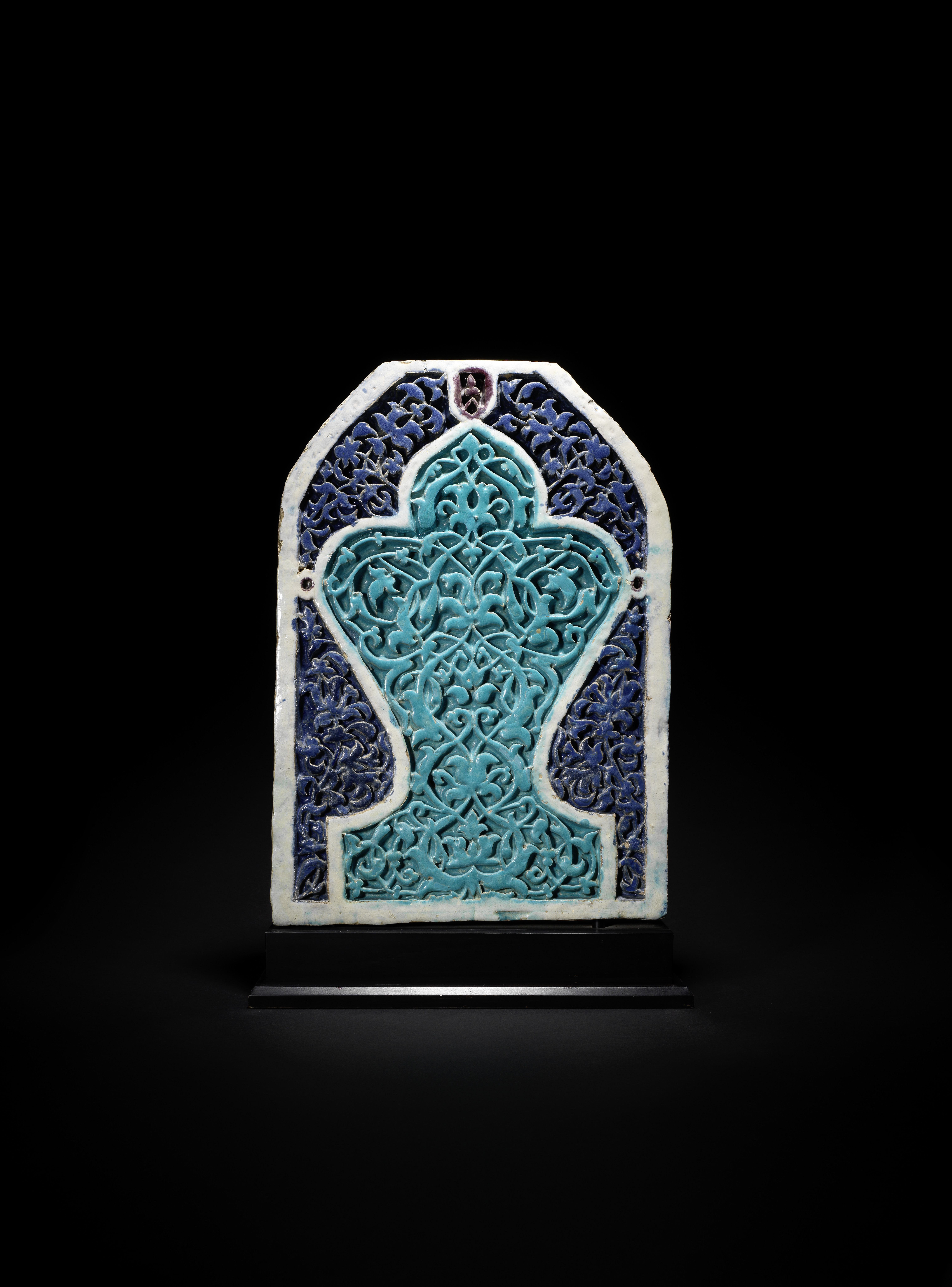 A Timurid moulded pottery mihrab tile Central Asia, second half of the 14th Century