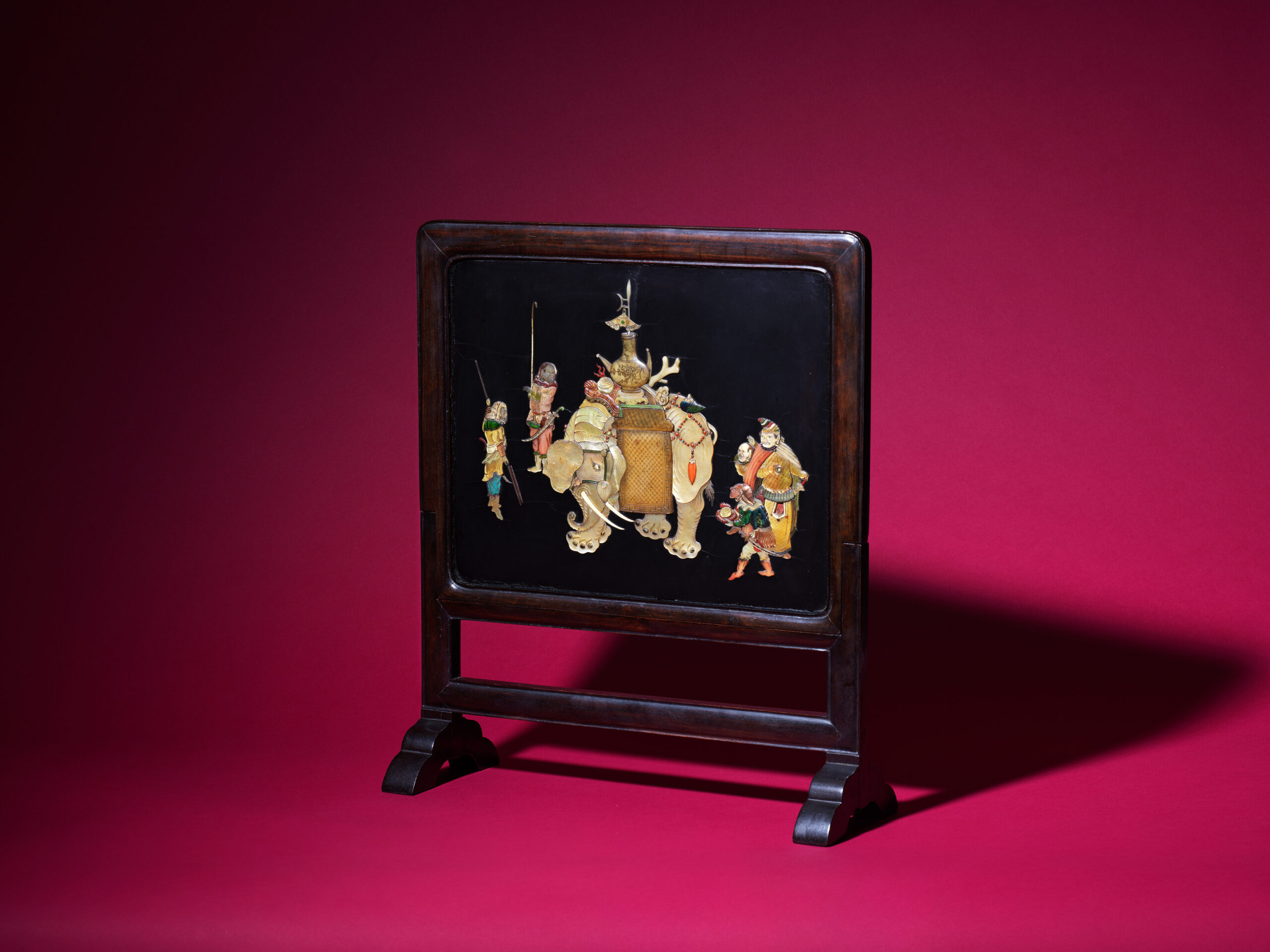 A hardstone and mother-of-pearl inlaid 'elephant and tribute bearers' screen