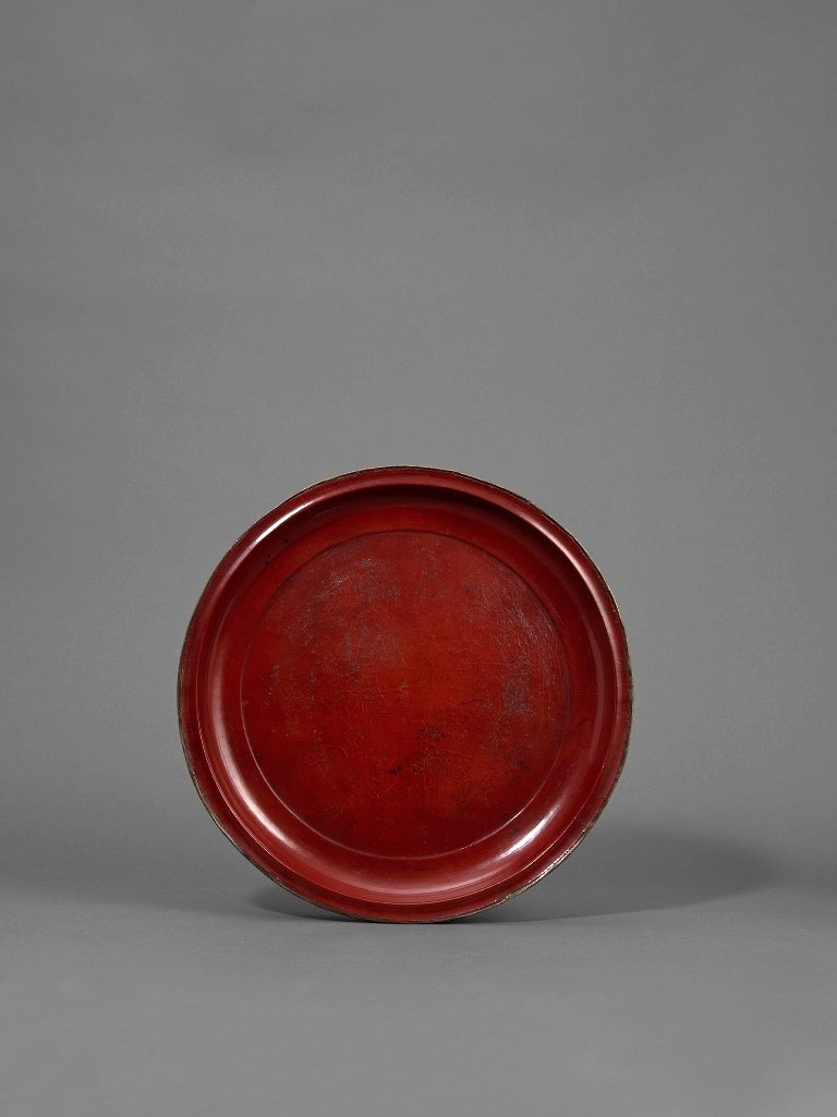A rare red lacquer circular dish (pan)