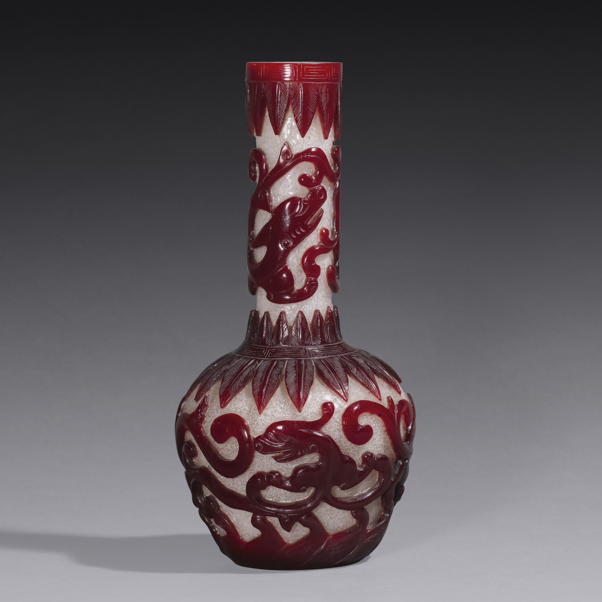 A ruby-red glass overlay chilong-pattern bottle vase