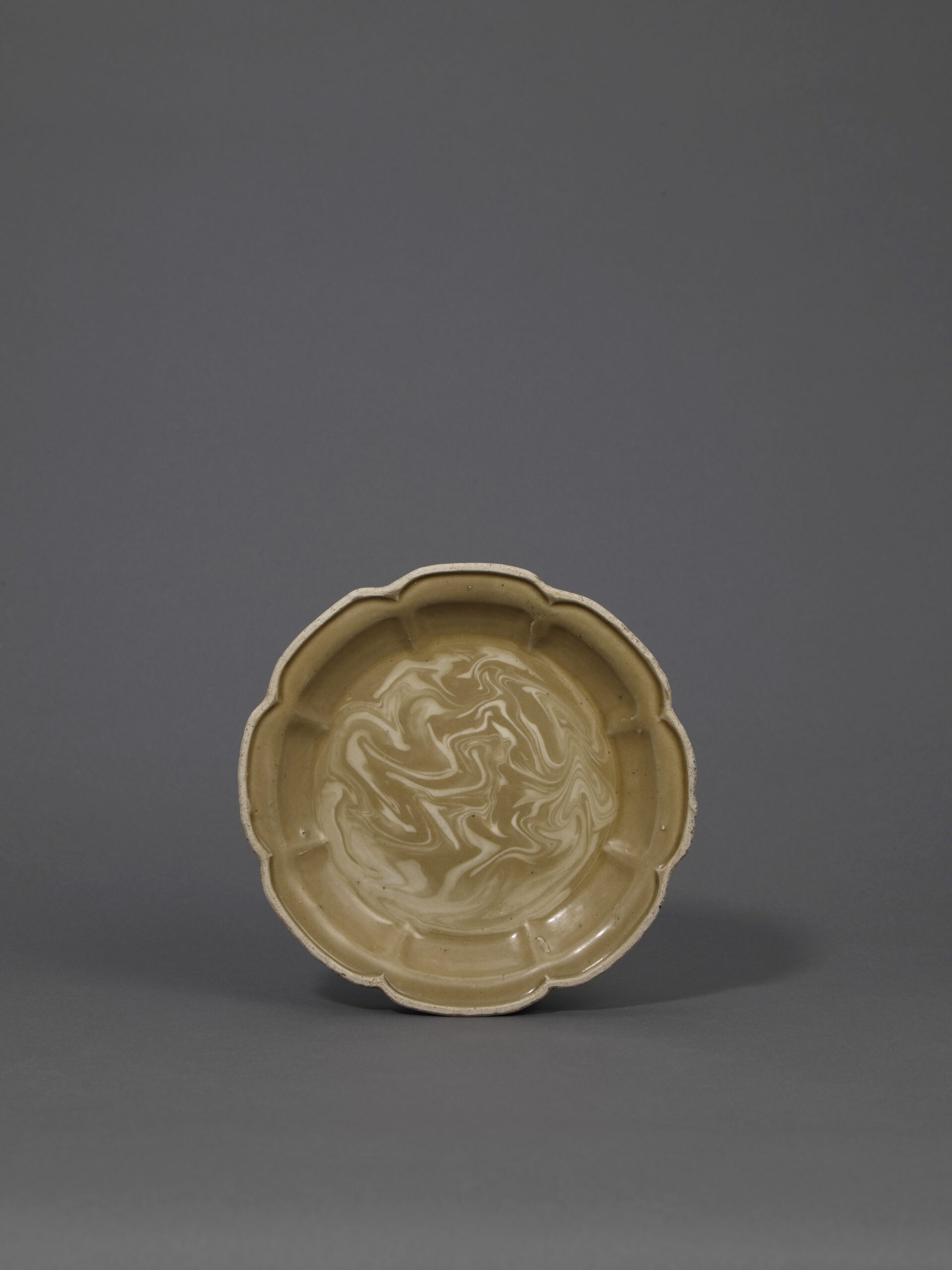 A very rare marble-glazed eight-lobed dish
