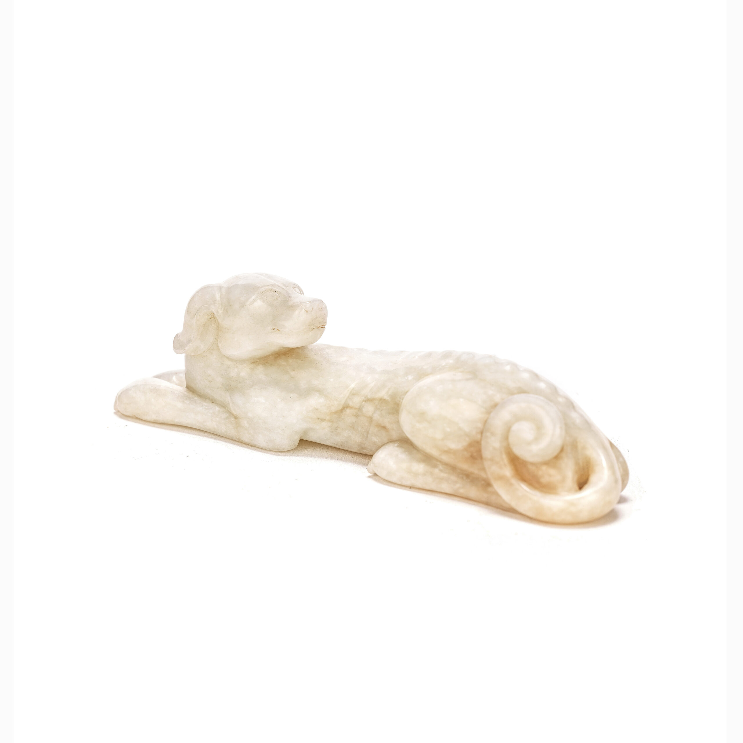 A white jade recumbent hound carving, Ming Dynasty