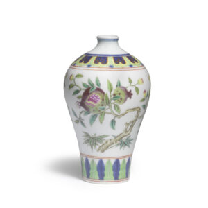 An exceptionally rare Imperial famille rose and underglaze blue pomegranate vase, Qianlong seal mark and of the period