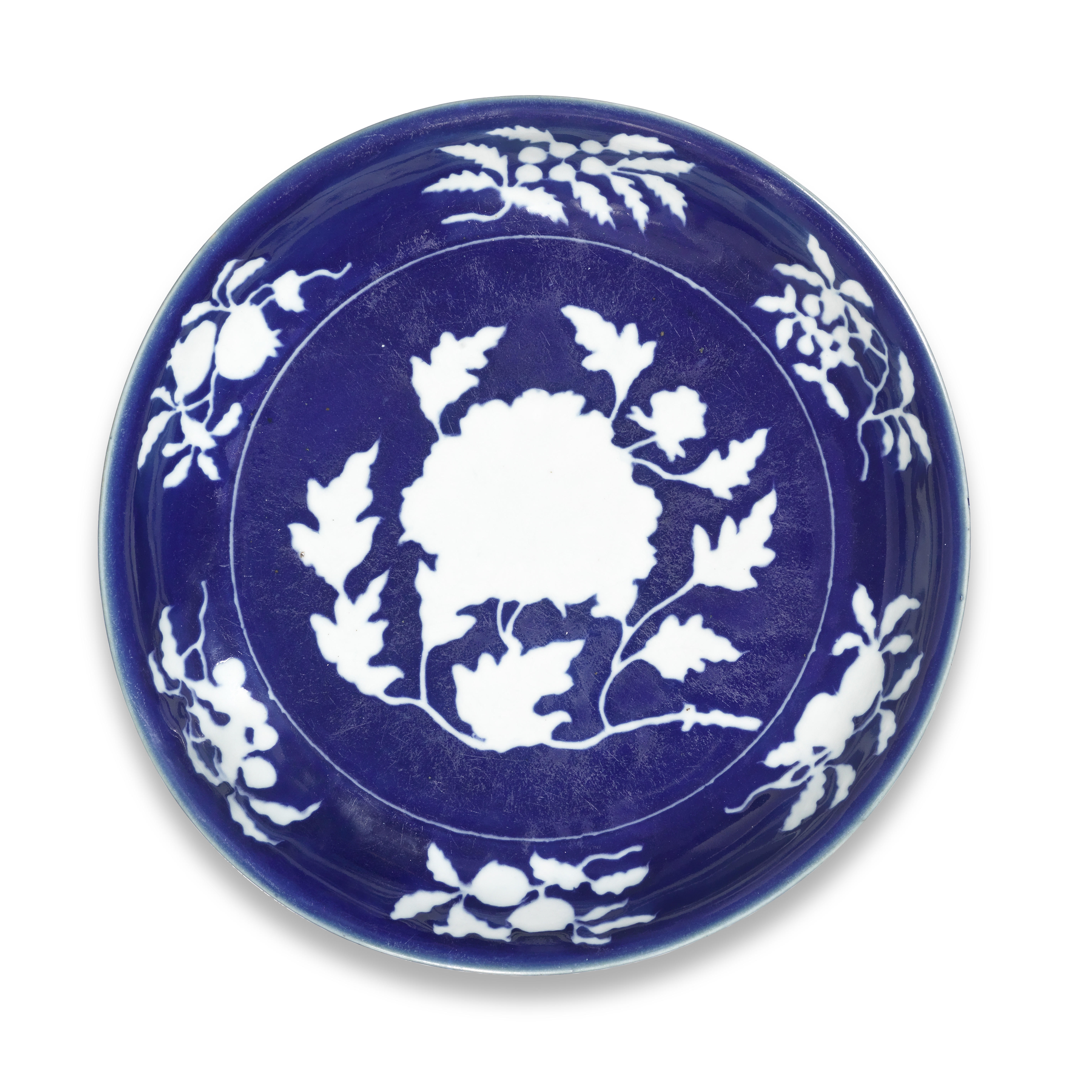 An exceptionally rare and large reserve-decorated peony dish, Xuande six-character mark in a line and of the period.