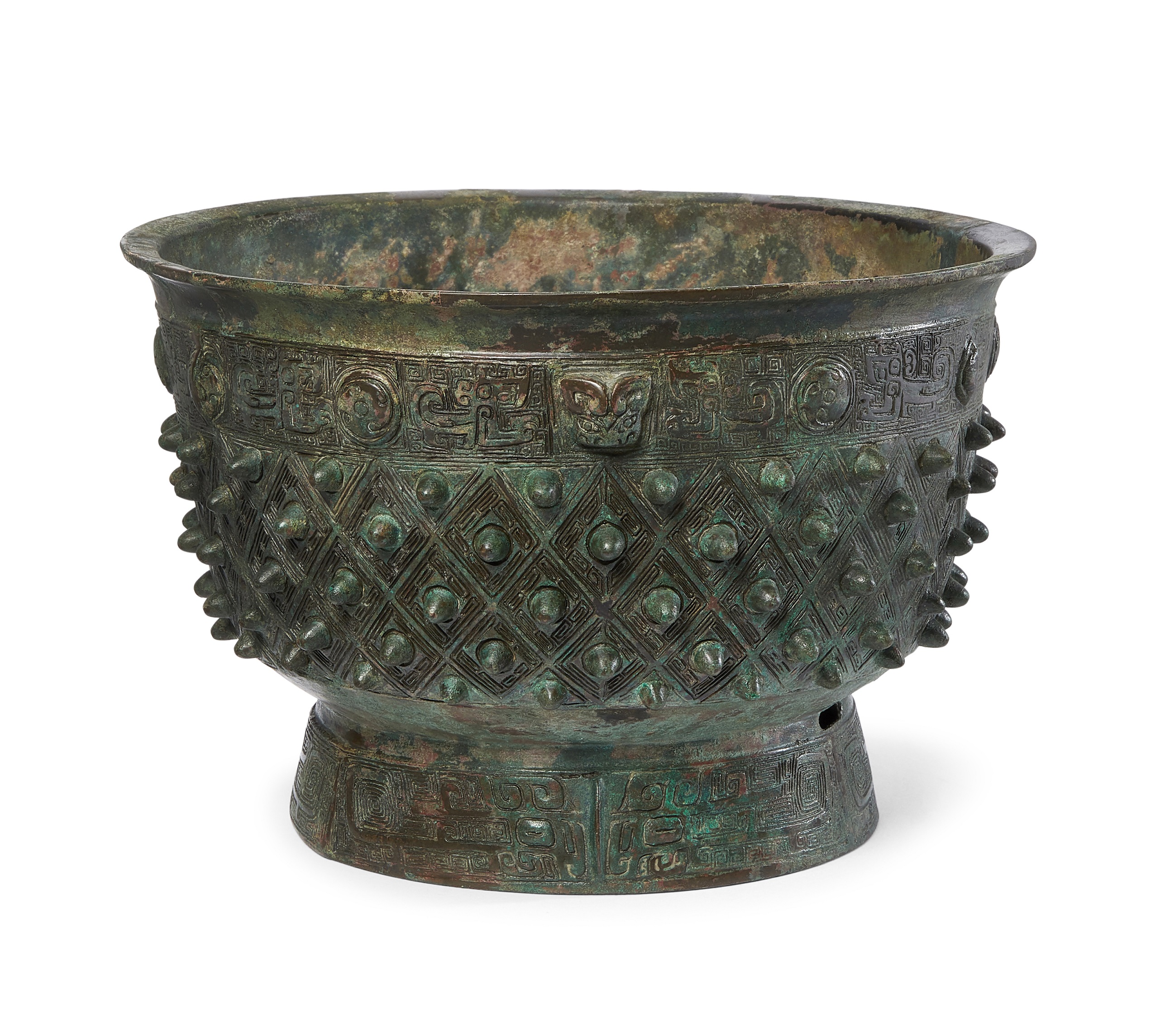 AN ARCHAIC BRONZE RITUAL VESSEL, 'YU', LATE SHANG DYNASTY, 16.4 cm high, 25.4 cm diam., £50,000-£80,000
AN ARCHAIC BRONZE RITUAL VESSEL, 'YU', LATE SHANG DYNASTY, 16.4 cm high, 25.4 cm diam., £50,000-£80,000