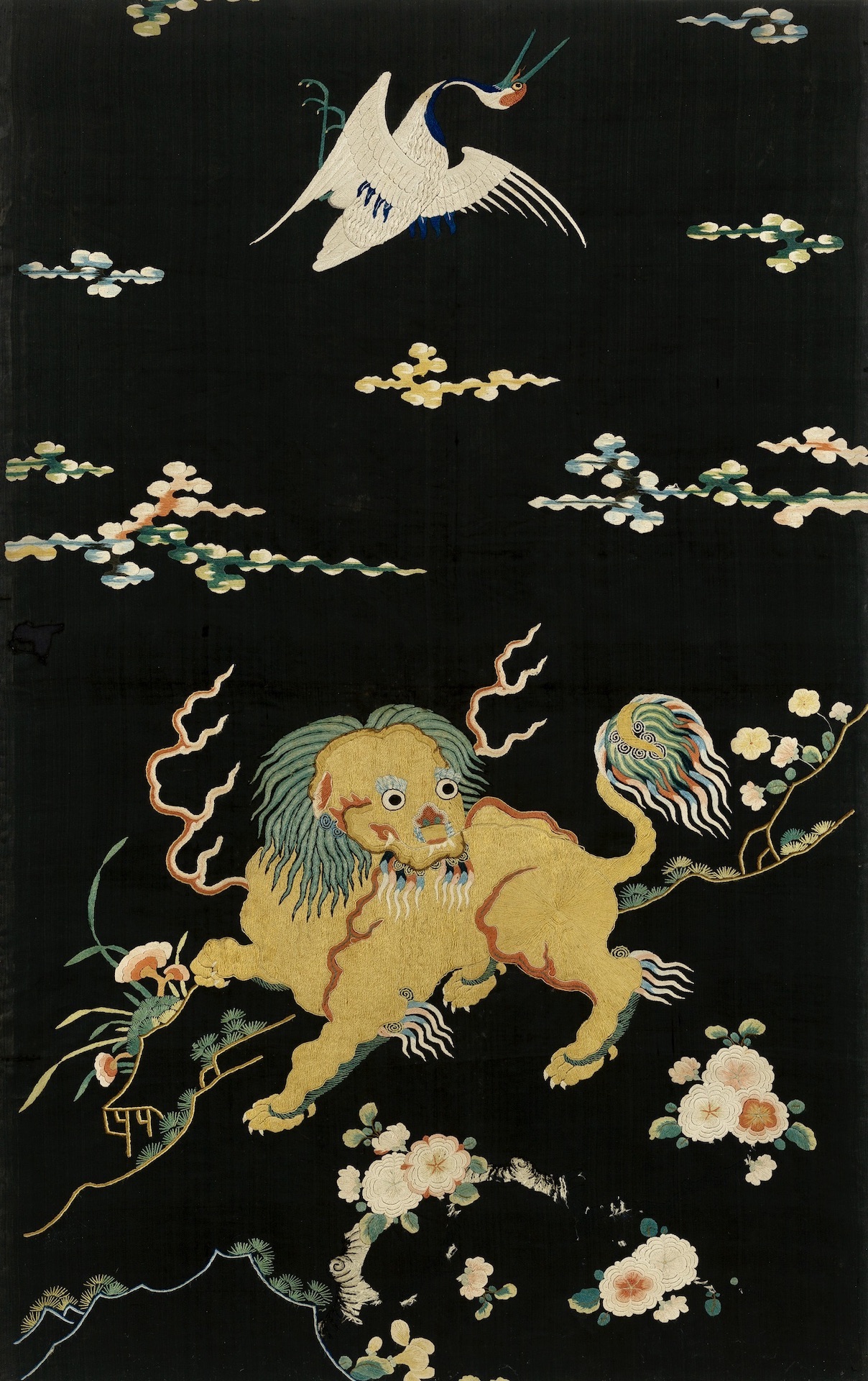 Embroidered chair back of a buddhist lion, Ming dynasty, 16th/17th century. 67 x 56 cm