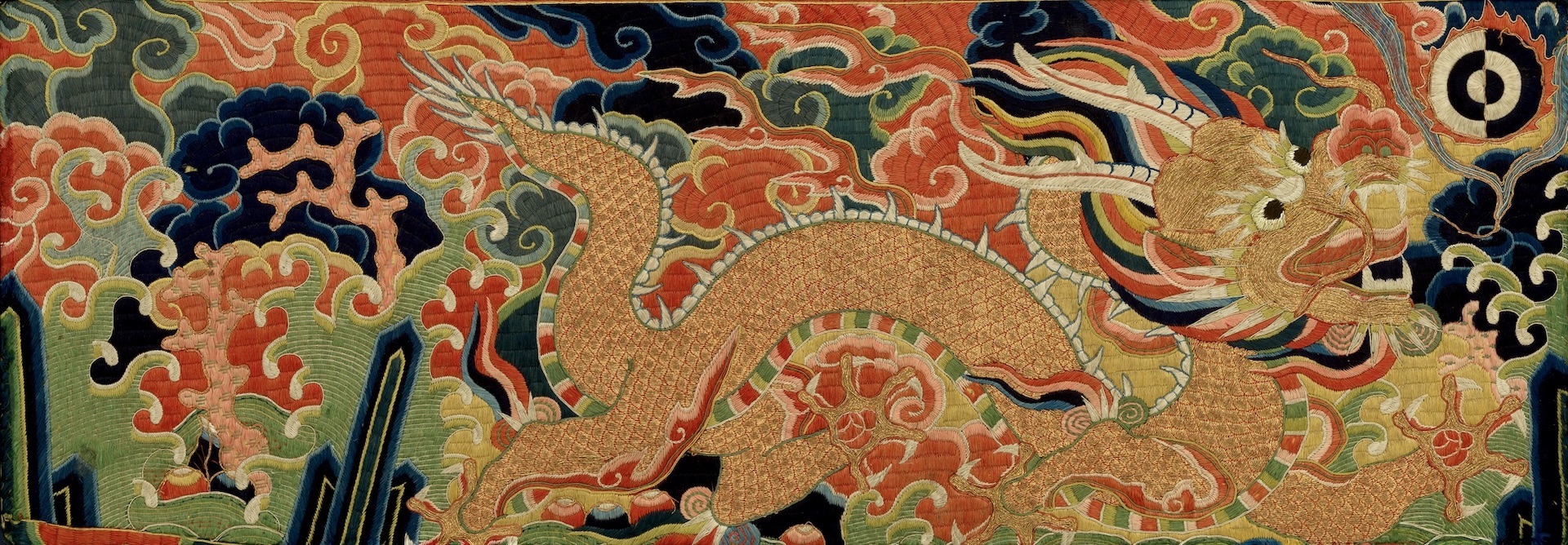 Embroidered running dragon from an imperial robe, Ming dynasty 16th/17th century. 33 x 73 cm