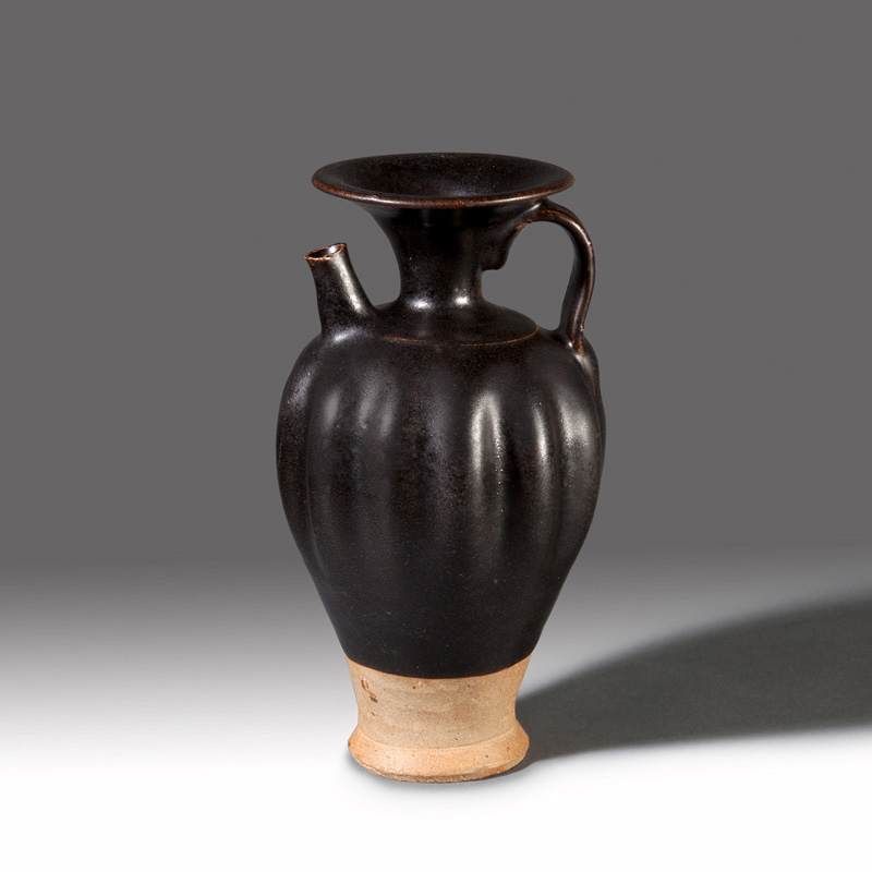 A Yaozhou black-glazed stoneware lobed ewer A Yaozhou black-glazed stoneware lobed ewer