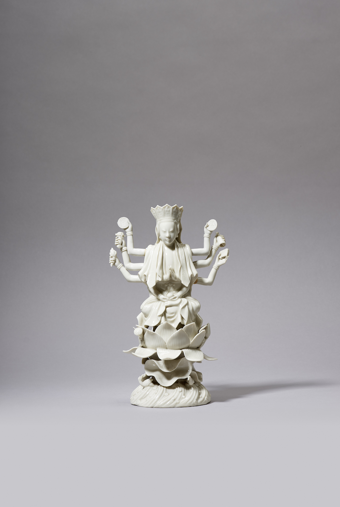 A DEHUA MULTI-ARMED FIGURE OF GUANYIN A DEHUA MULTI-ARMED FIGURE OF GUANYIN