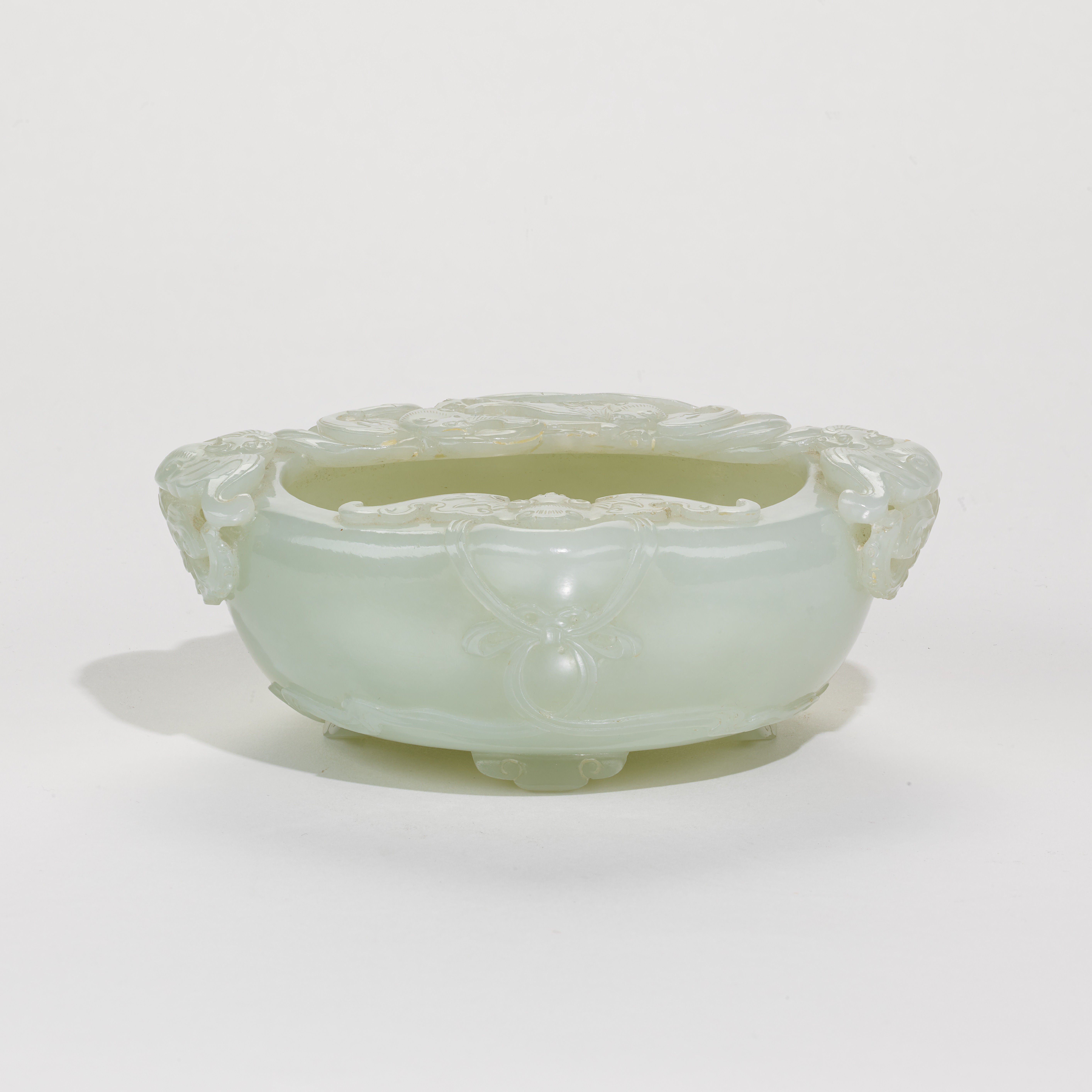 A well carved pale celadon jade ‹bats› brushwasher, Qing dynasty, 18th century