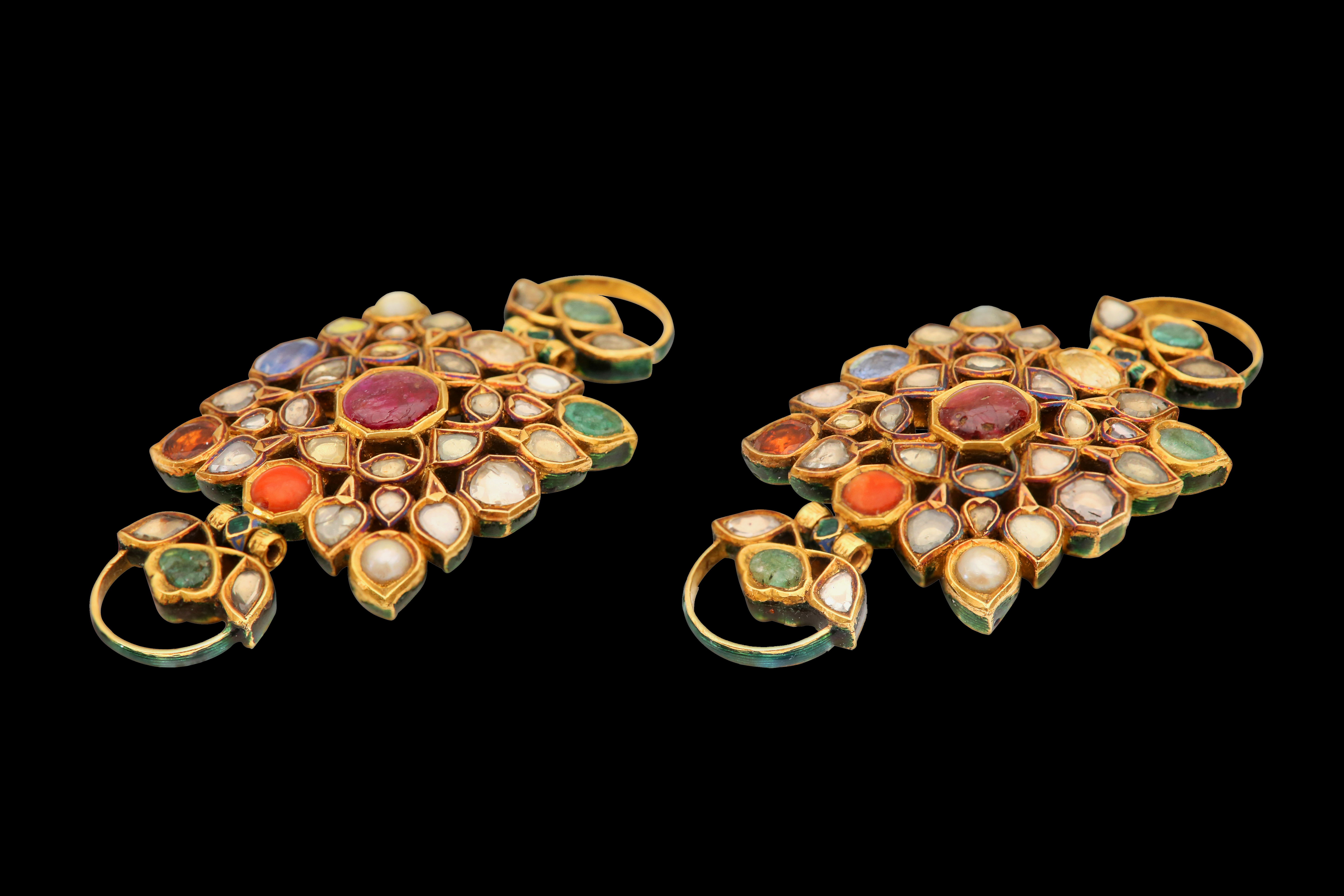 A PAIR OF ENAMELLED GOLD NINE-GEM (NAVRATNA) ARMLETS (BAZUBAND)