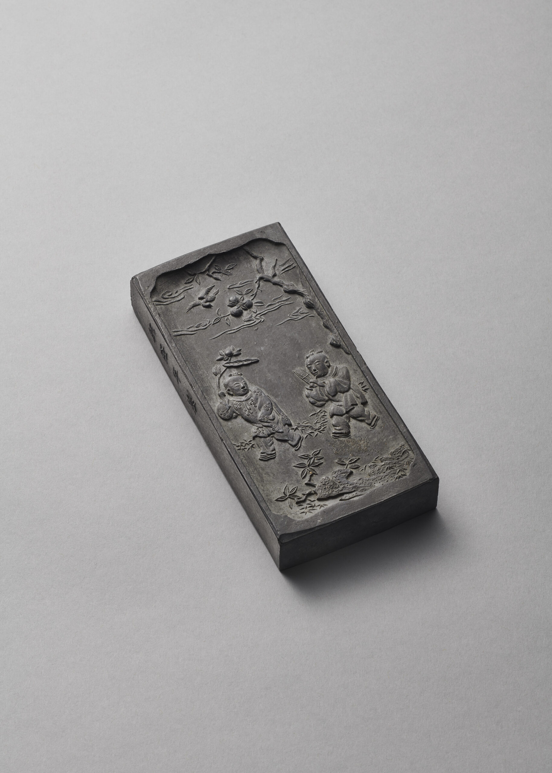An inscribed ‘Hehe Erxian’ rectangular ink cake (Qianlong carved four-character mark and of the period, 1736-1795)