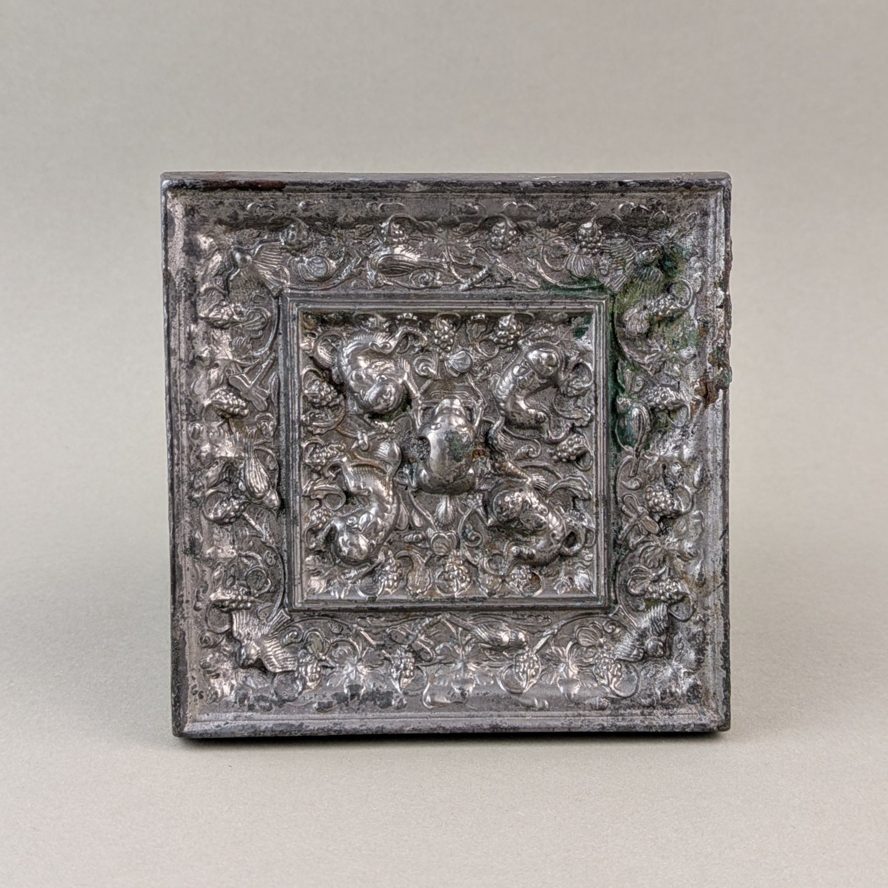 A rare square ‘lion and grapevine’ bronze mirror